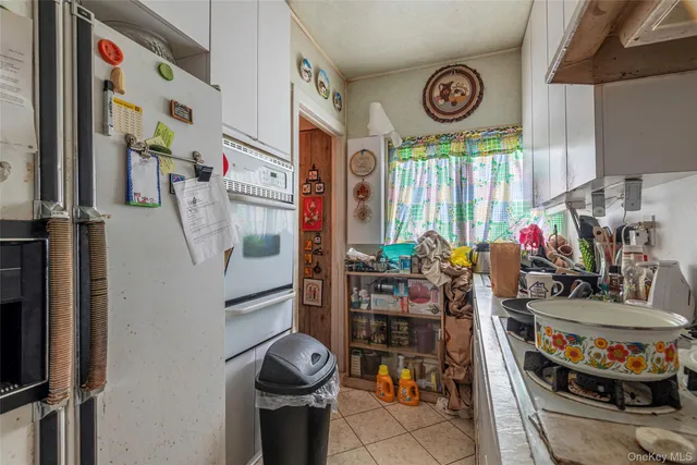 a view of living room with furniture and a window