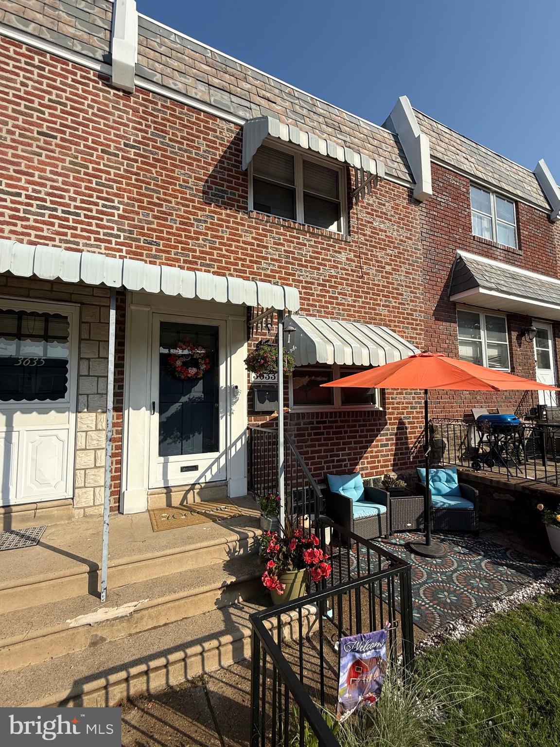 3633 Weightman Street Philadelphia, PA 19129 - Photo 2 of 25 a view of a patio with table and chairs potted plants
