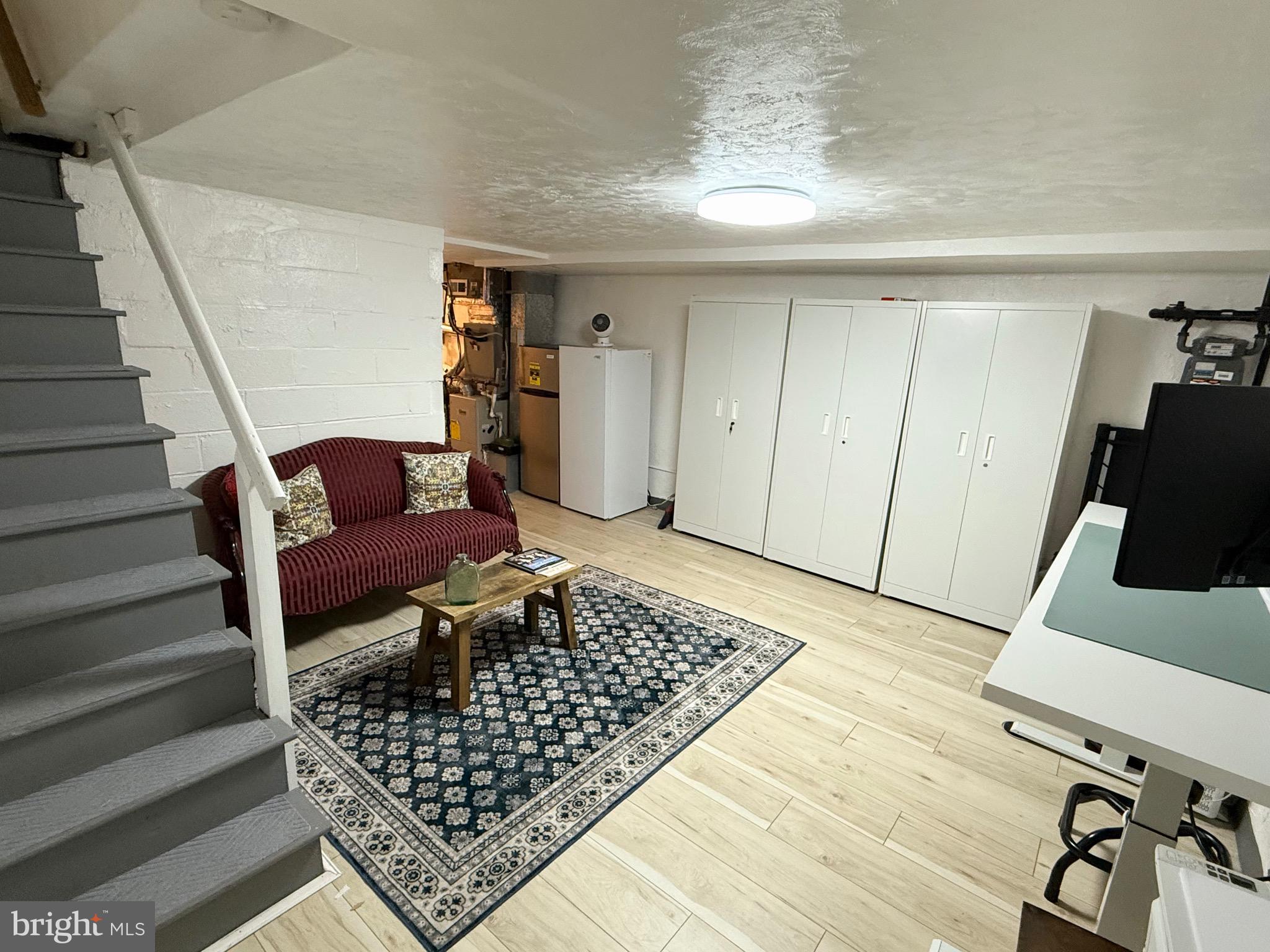3633 Weightman Street Philadelphia, PA 19129 - Photo 21 of 25 a living room with furniture and a rug