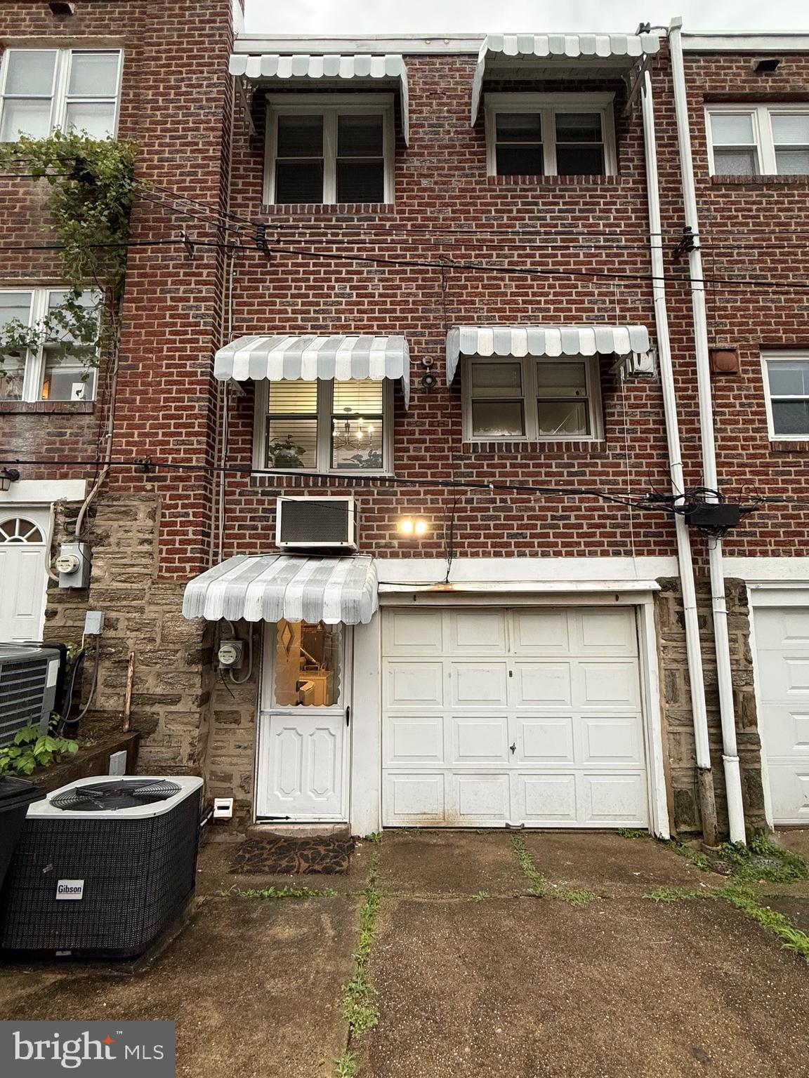 3633 Weightman Street Philadelphia, PA 19129 - Photo 24 of 25 a front view of a house with garage