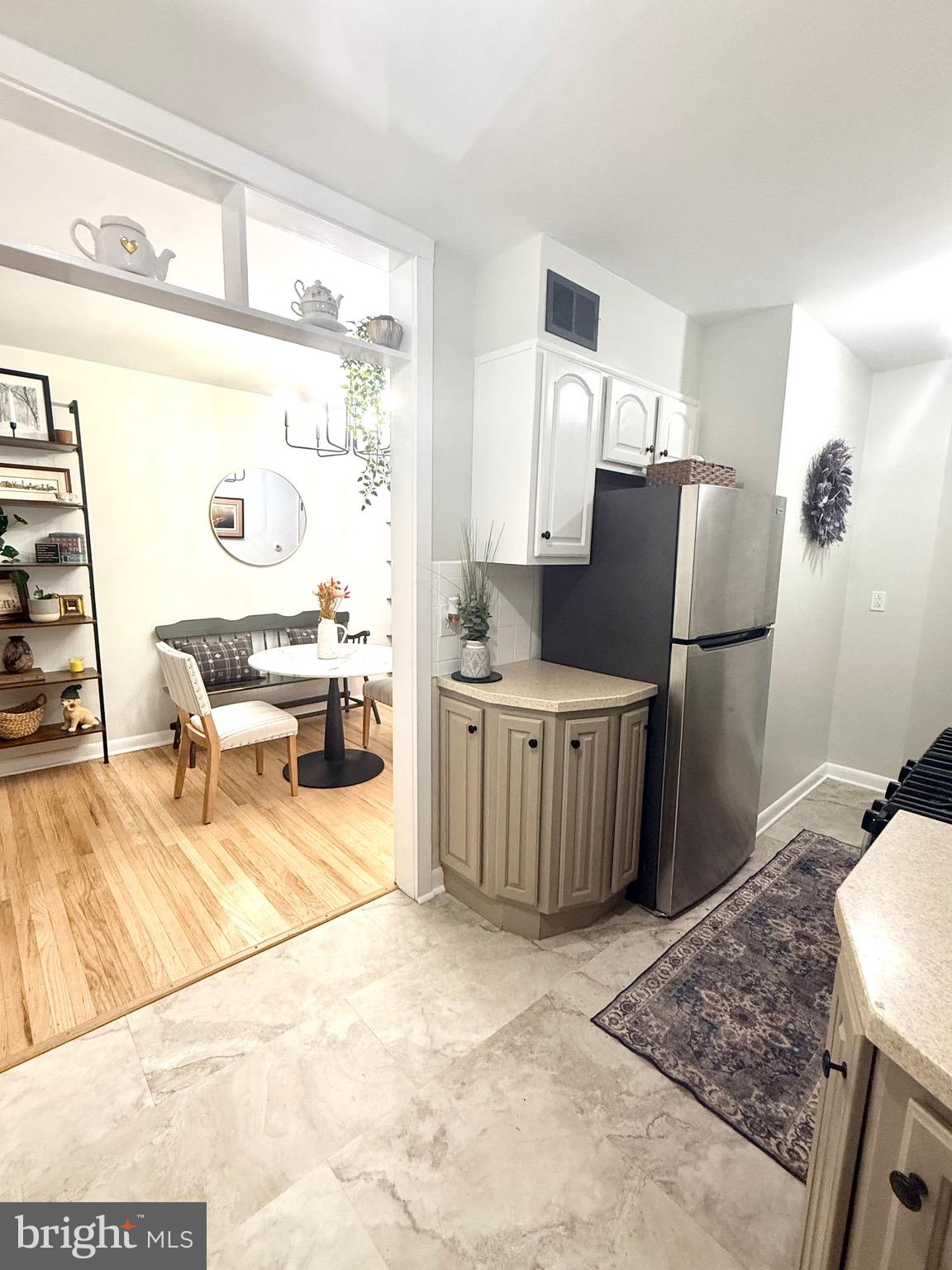 3633 Weightman Street Philadelphia, PA 19129 - Photo 7 of 25 a living room with a couch and a dining table