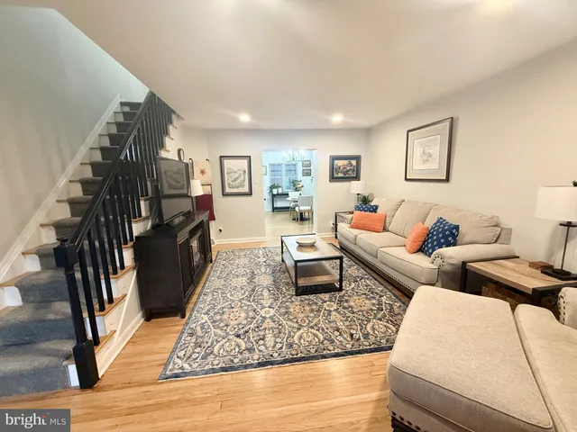 a living room with furniture and a rug