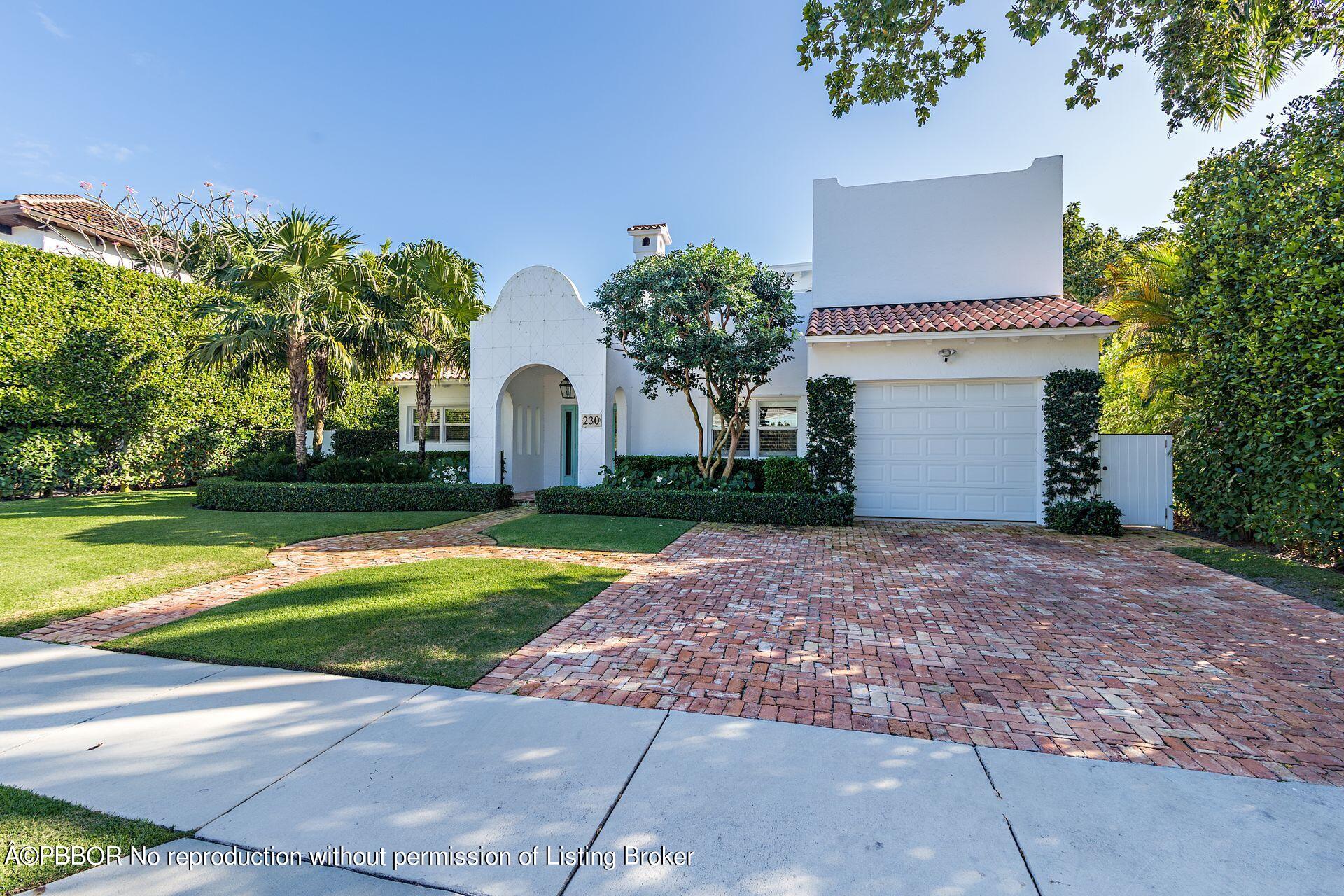 230 Alpine Road West Palm Beach, FL 33405 - Photo 1 of 31 a front view of a house with garden