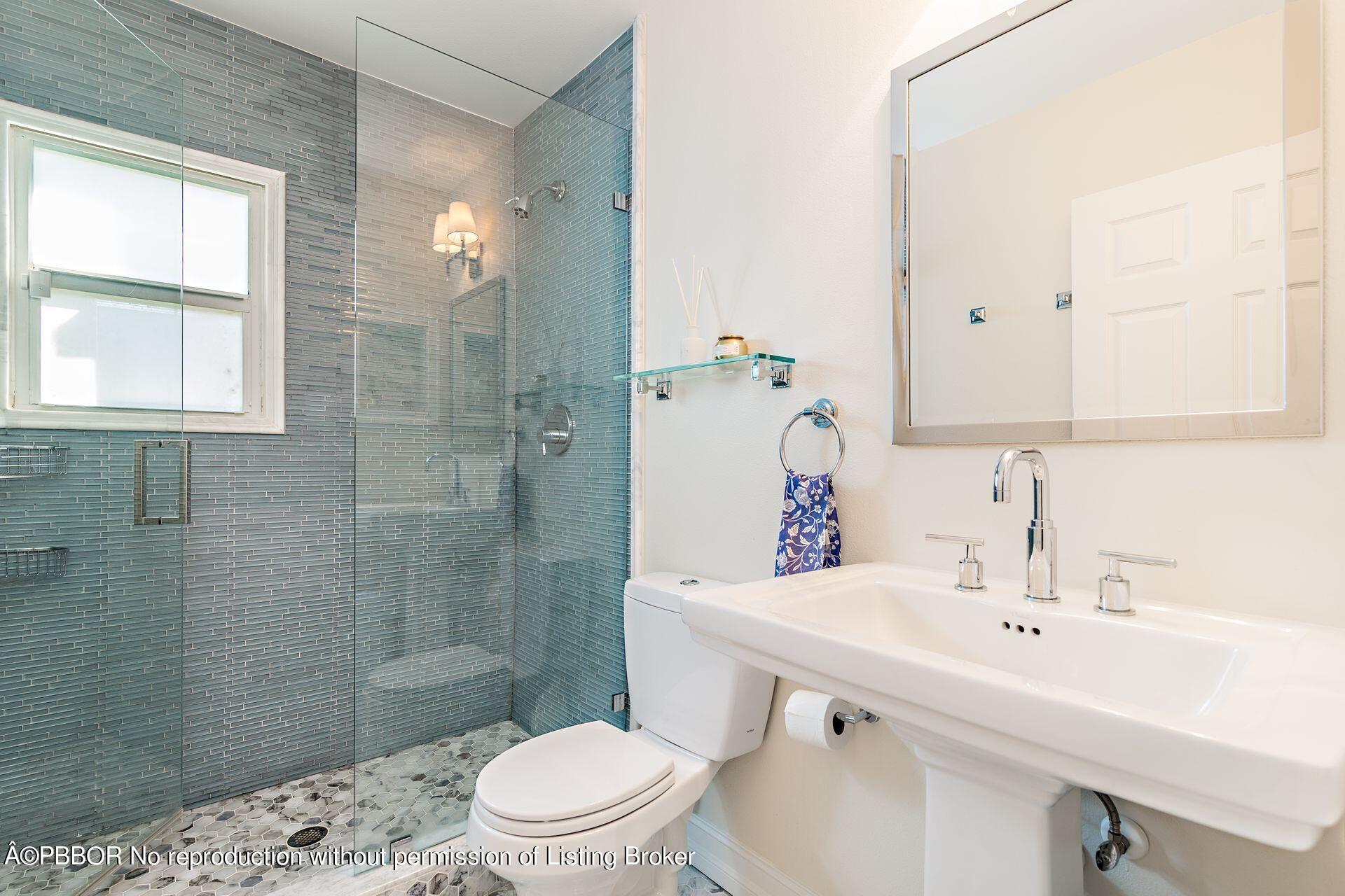 230 Alpine Road West Palm Beach, FL 33405 - Photo 16 of 31 a bathroom with a sink a toilet and shower