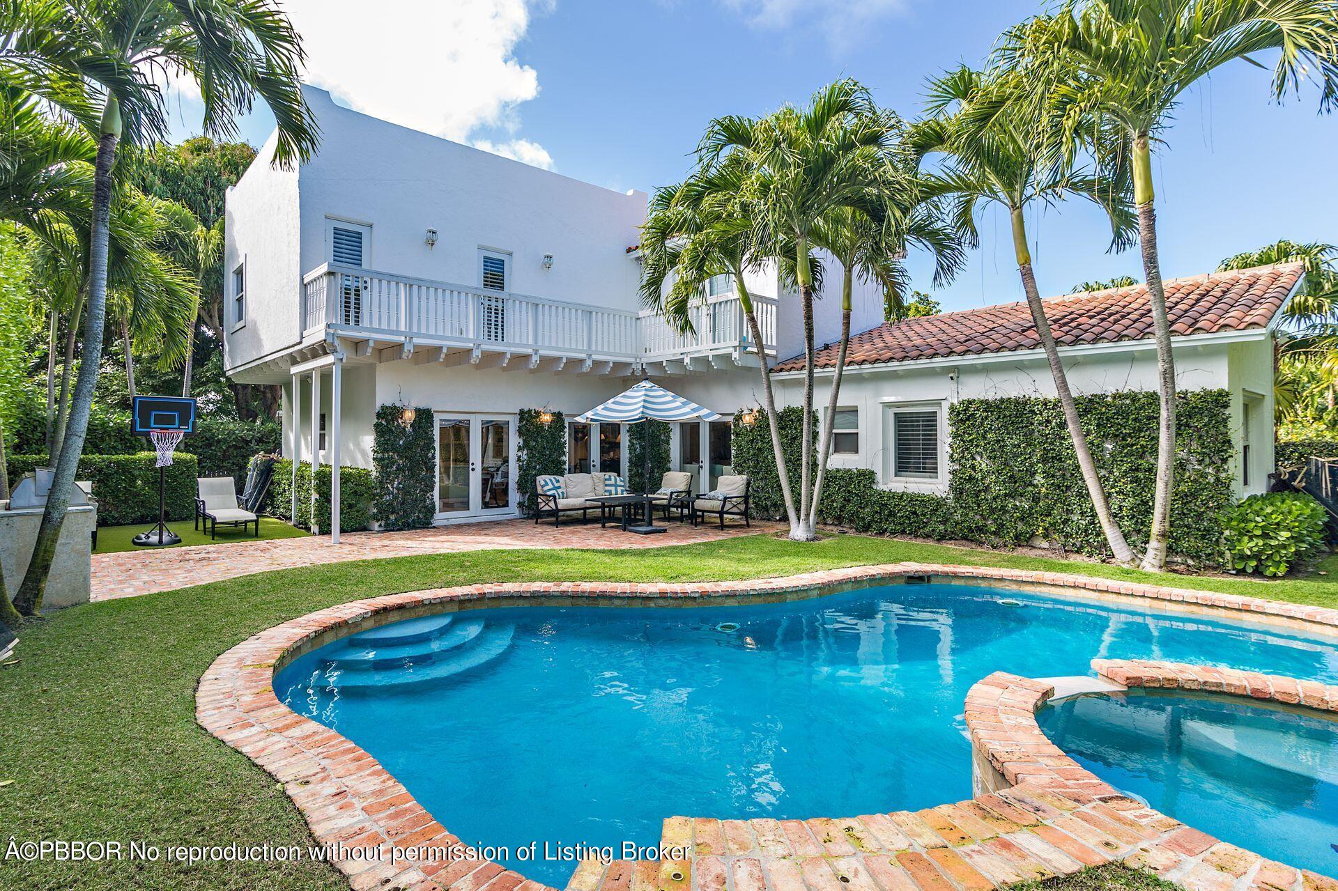 230 Alpine Road West Palm Beach, FL 33405 - Photo 20 of 31 a swimming pool with outdoor seating and yard