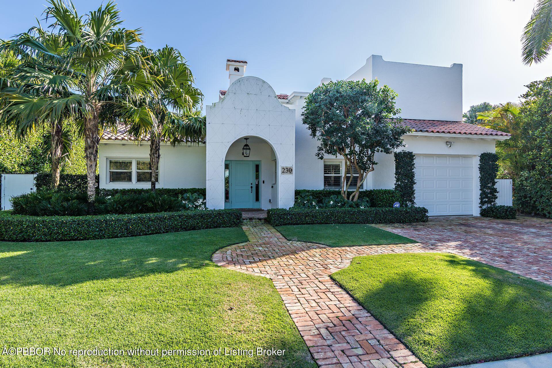 230 Alpine Road West Palm Beach, FL 33405 - Photo 3 of 31 a front view of a house with garden
