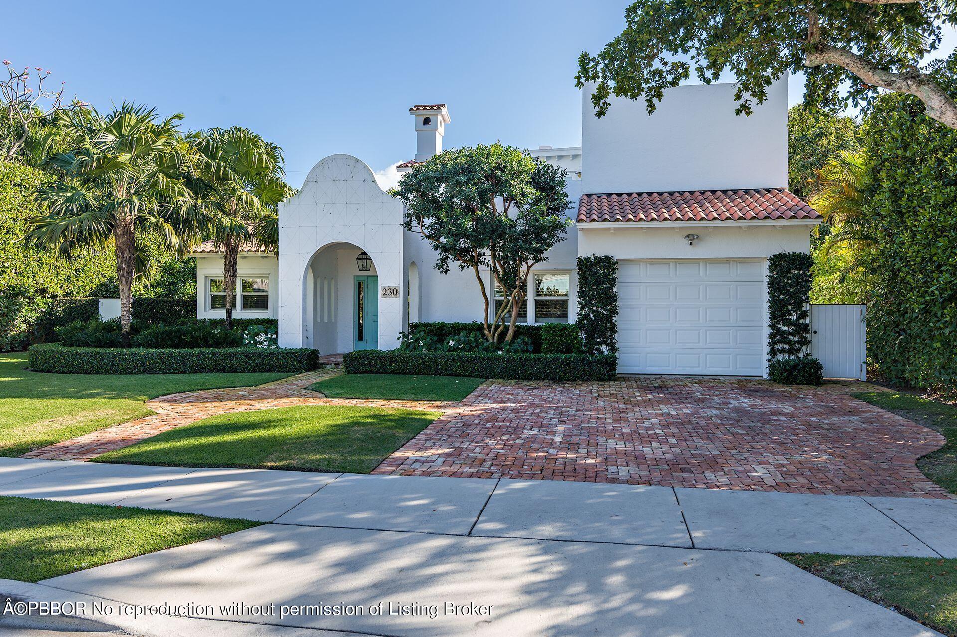 230 Alpine Road West Palm Beach, FL 33405 - Photo 4 of 31 a front view of a house with a yard