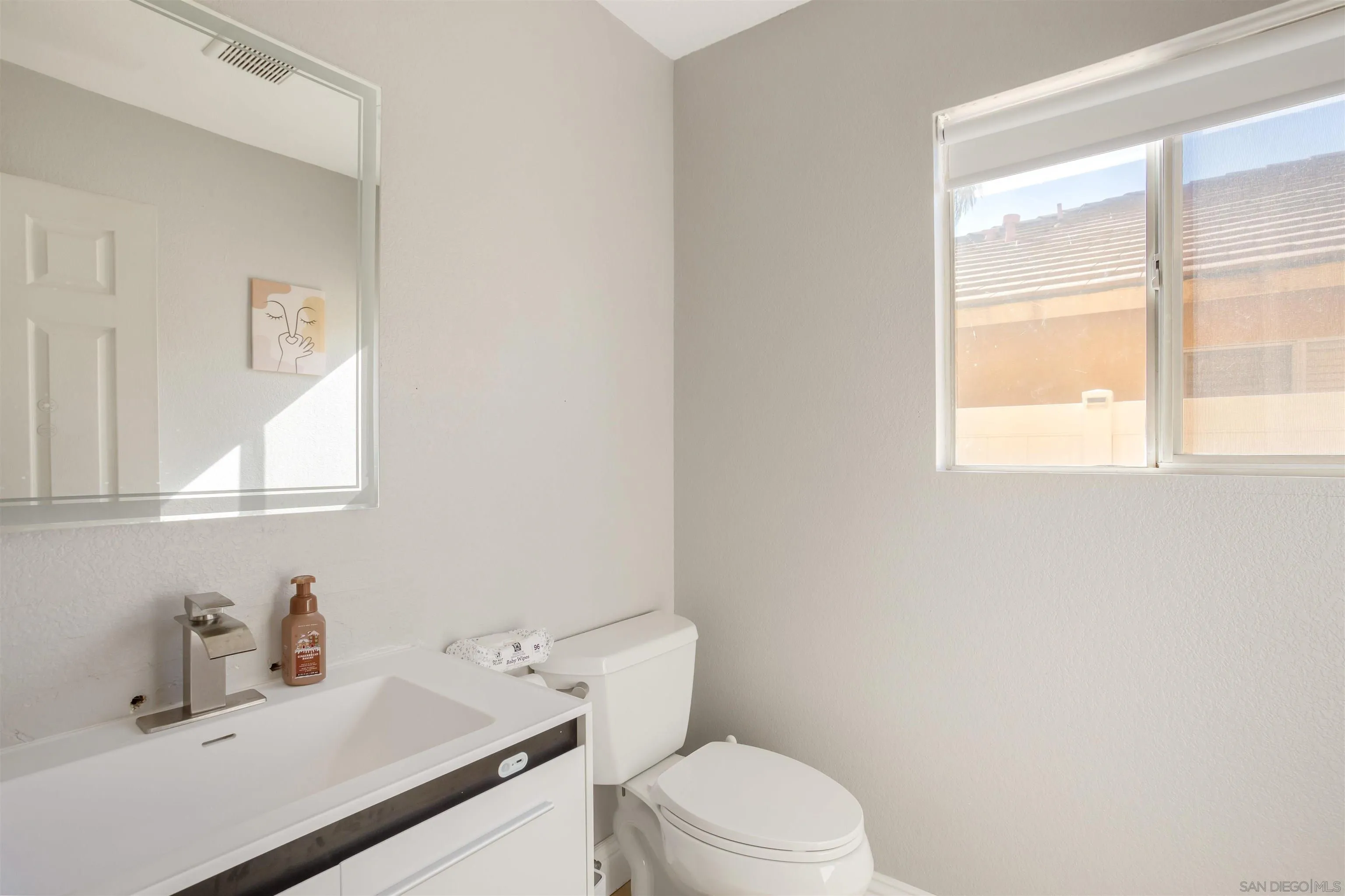 32812 Tulley Ranch Road Temecula, CA 92592 - Photo 14 of 35 a bathroom with a sink a toilet and a window