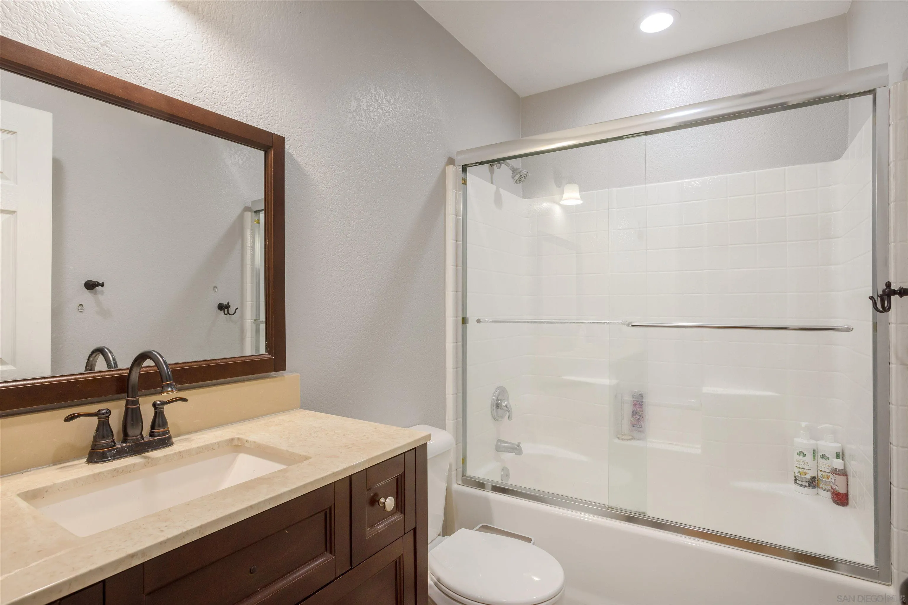 32812 Tulley Ranch Road Temecula, CA 92592 - Photo 21 of 35 a bathroom with a granite countertop sink toilet and shower