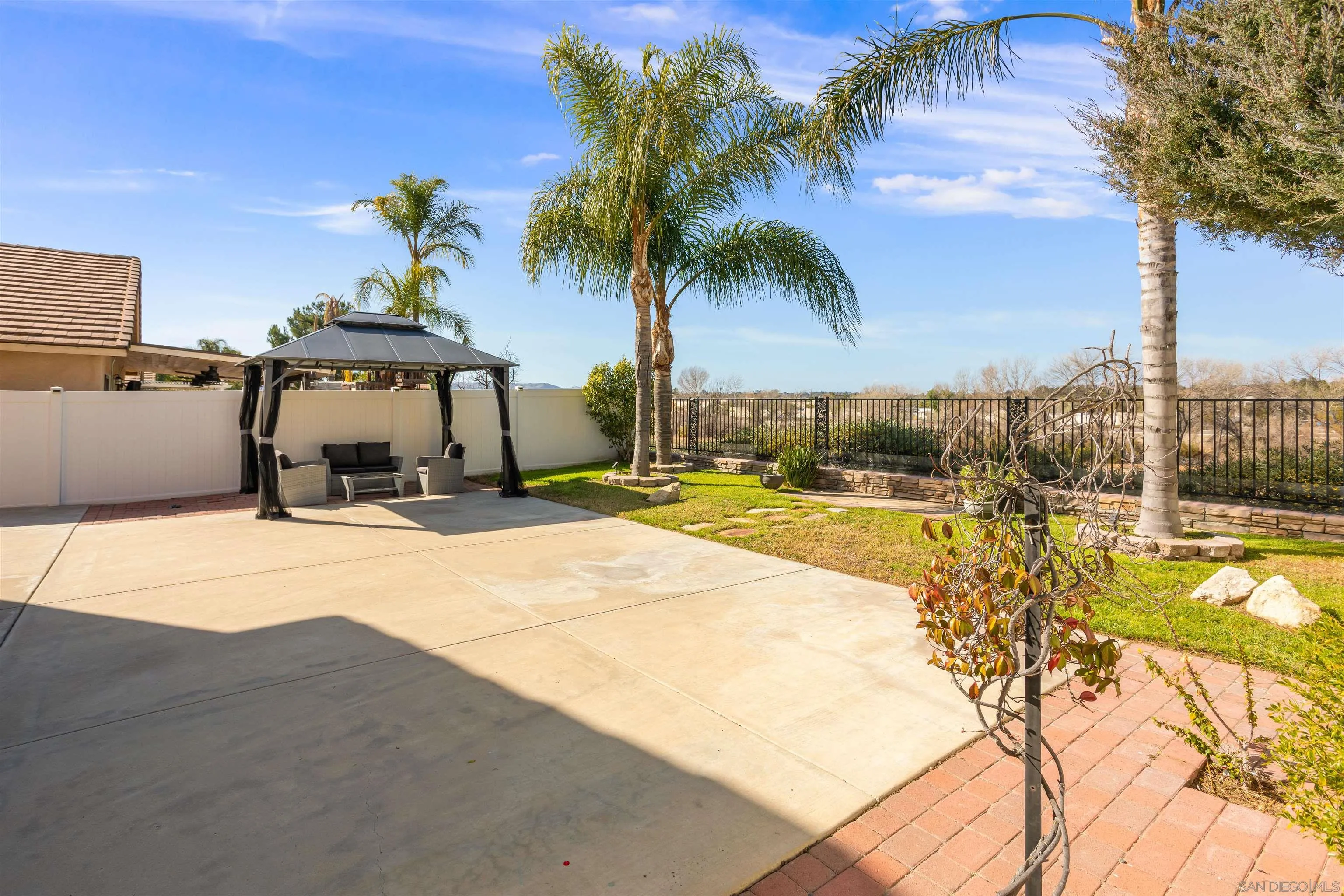 32812 Tulley Ranch Road Temecula, CA 92592 - Photo 23 of 35 a house with a yard and palm trees