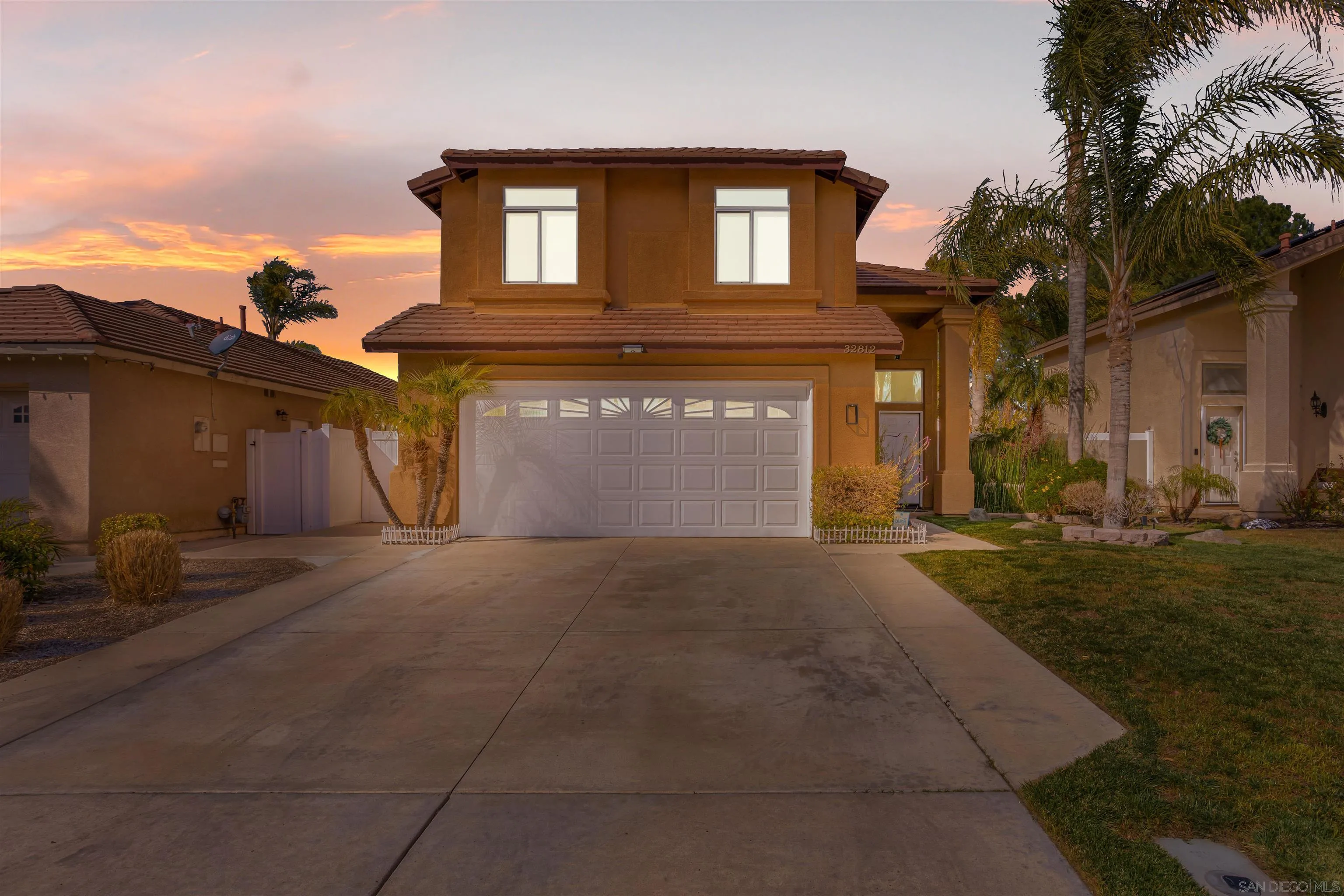 32812 Tulley Ranch Road Temecula, CA 92592 - Photo 3 of 35 a front view of a house with a yard and garage