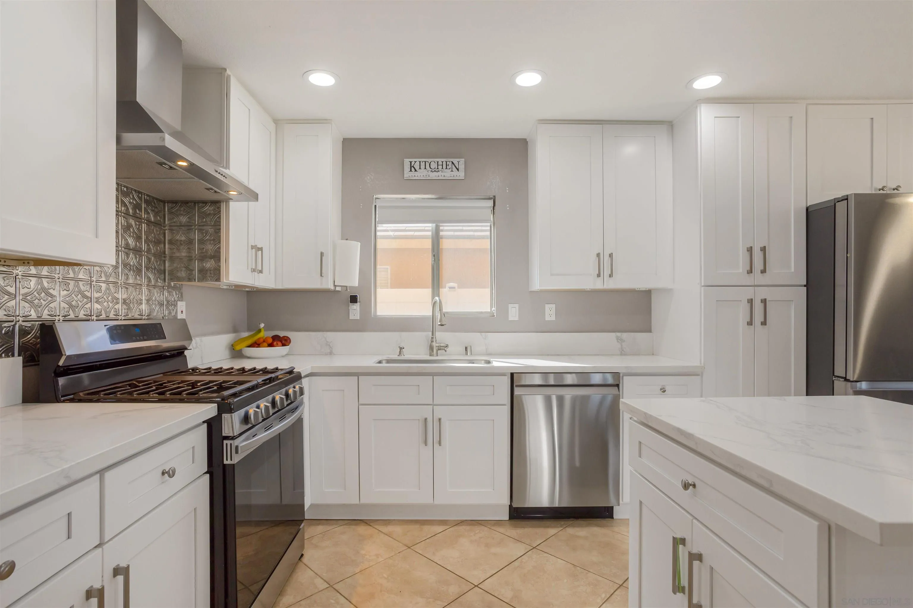 32812 Tulley Ranch Road Temecula, CA 92592 - Photo 7 of 35 a kitchen with a sink stove and refrigerator