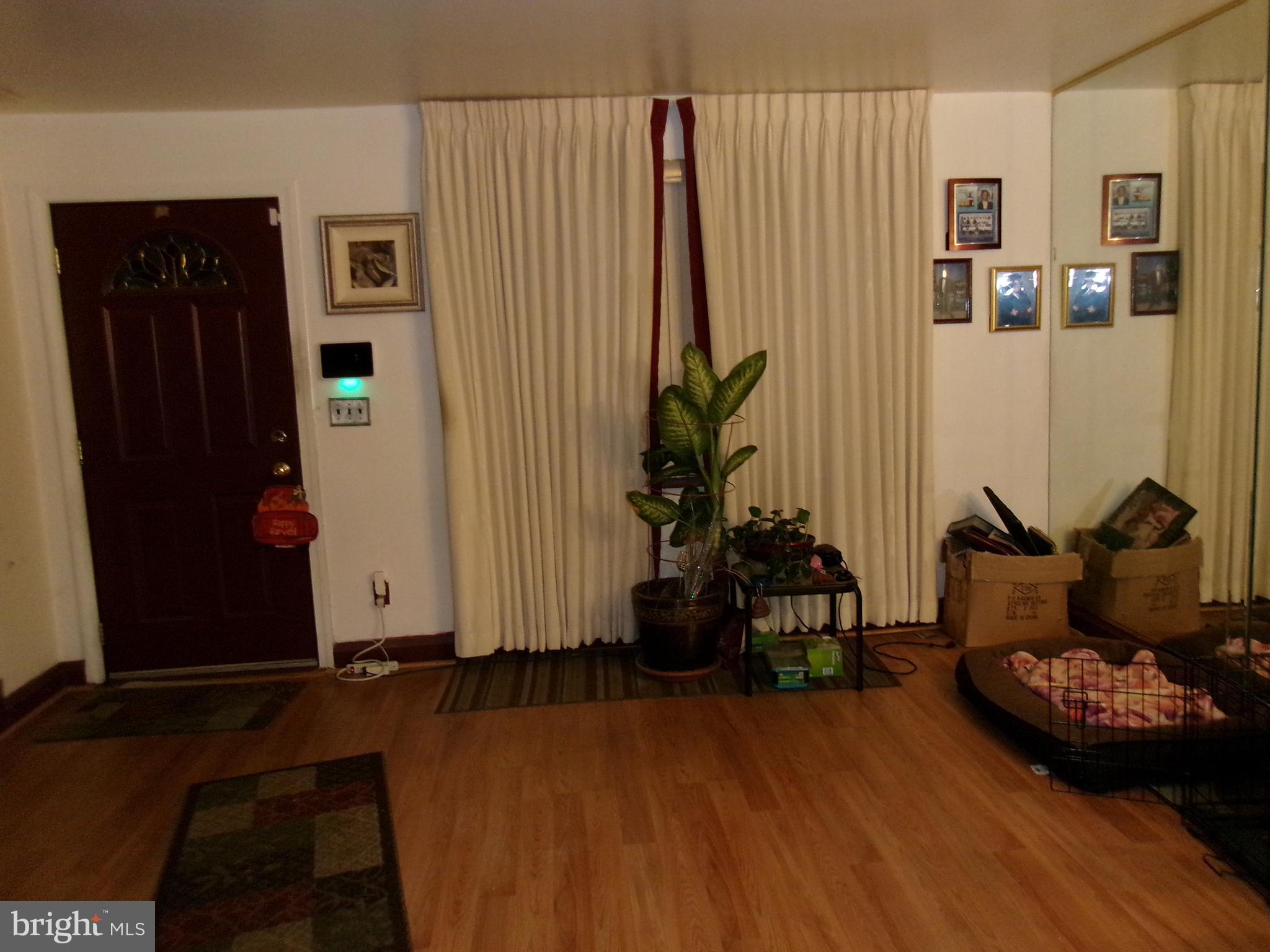 2014 Crestview Road Baltimore, MD 21239 - Photo 3 of 9 a living room with furniture and a wooden floor
