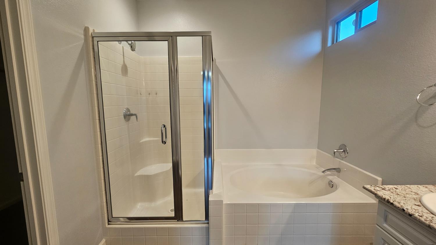 3351 Cordova Avenue Clovis, CA 93619 - Photo 12 of 33 a bathroom with a tub shower and sink