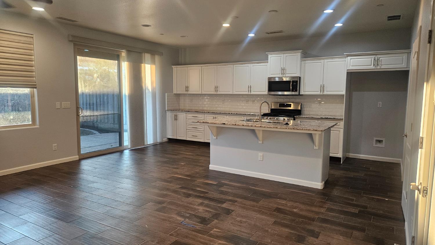 3351 Cordova Avenue Clovis, CA 93619 - Photo 23 of 33 a kitchen with stainless steel appliances granite countertop a stove a sink and a refrigerator