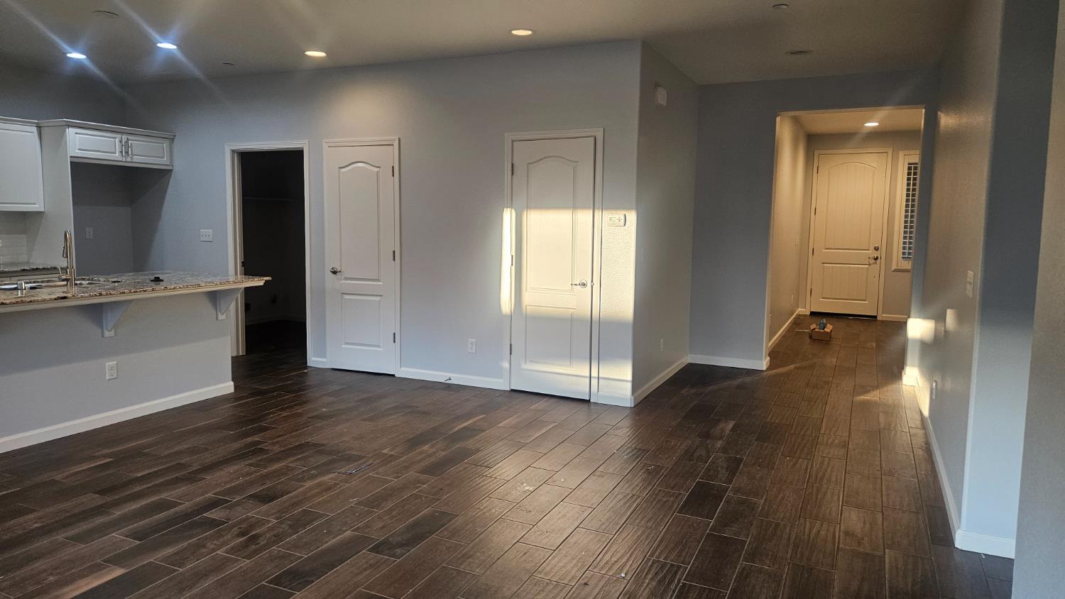 3351 Cordova Avenue Clovis, CA 93619 - Photo 25 of 33 a view of a hallway with wooden floor and a living room