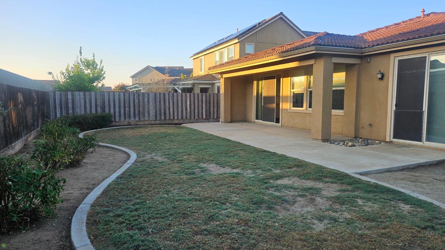 3351 Cordova Avenue Clovis, CA 93619 - Photo 33 of 33 a view of a house with a small yard and wooden fence