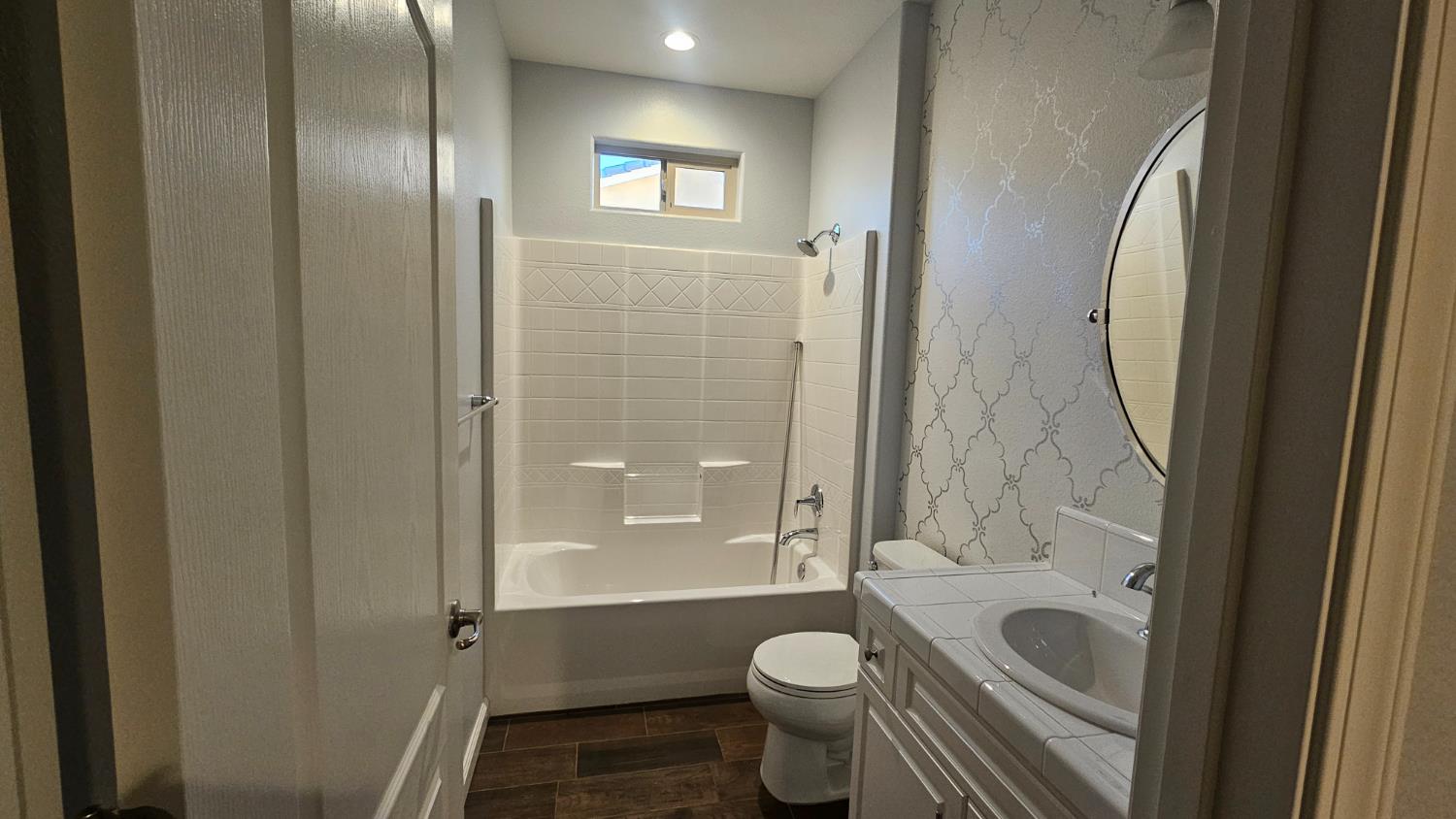 3351 Cordova Avenue Clovis, CA 93619 - Photo 4 of 33 a bathroom with a granite countertop toilet a sink and a mirror