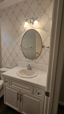 a bathroom with a sink and a mirror