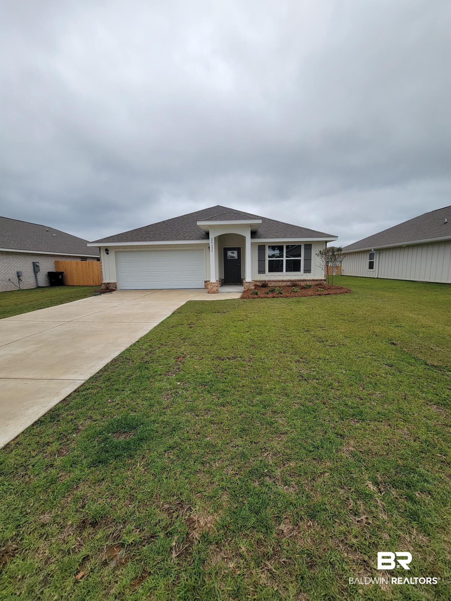 24625 Ponder Loop Loxley, AL 36551 - Photo 17 of 30 View of front of house with a garage and a front yard