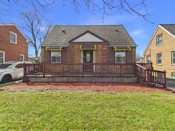 a front view of a house with wooden fence