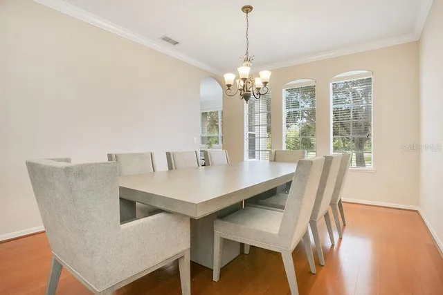 a view of a dining room with furniture window and outside view
