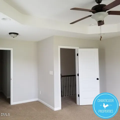 a view of an empty room and wooden floor