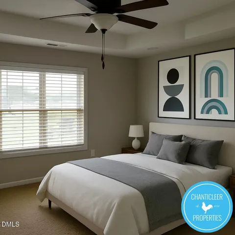 a bedroom with a bed and a painting on the wall