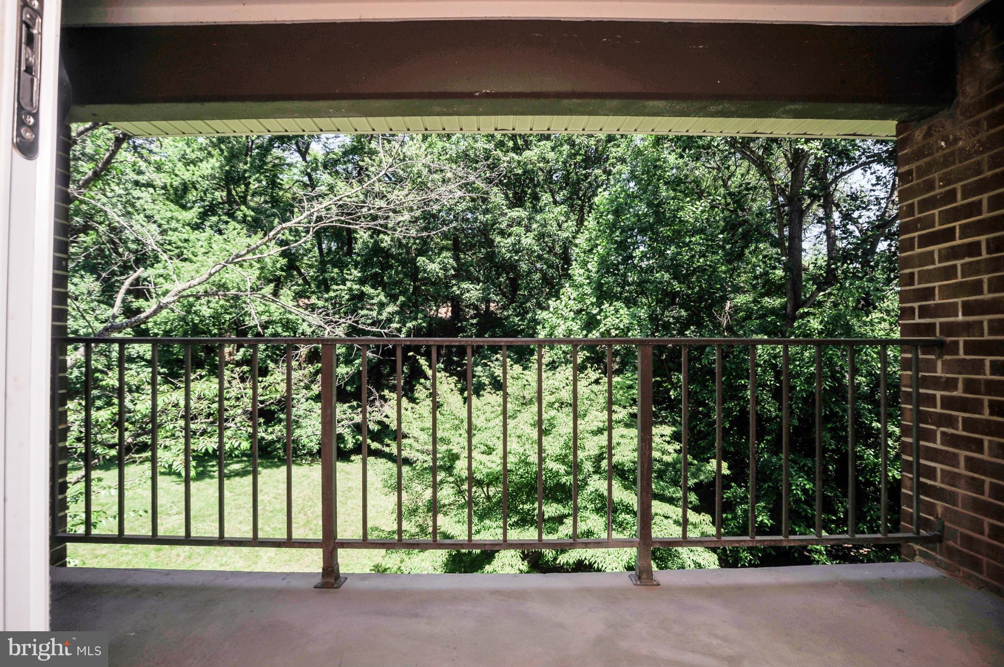1420 Northgate Square, Unit 21B Reston, VA 20190 - Photo 3 of 30 Balcony off Living Room with Wooded Views