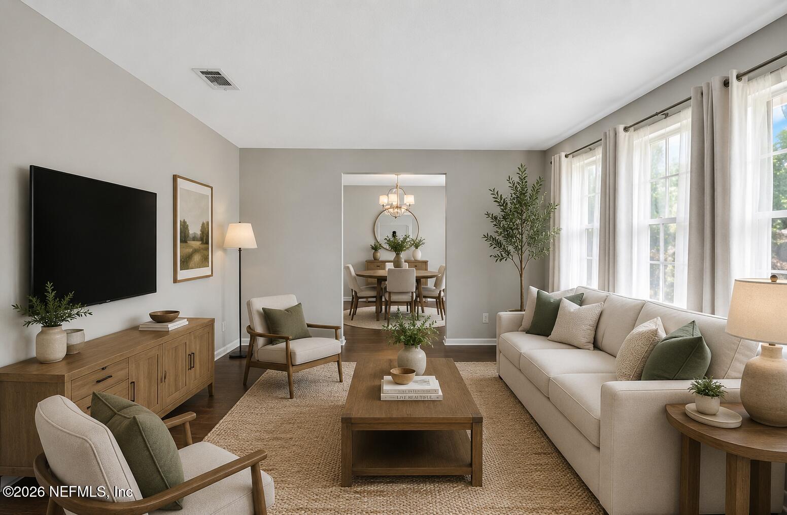 717 Estates Cove Road Jacksonville, FL 32221 - Photo 15 of 41 a living room with furniture and a flat screen tv