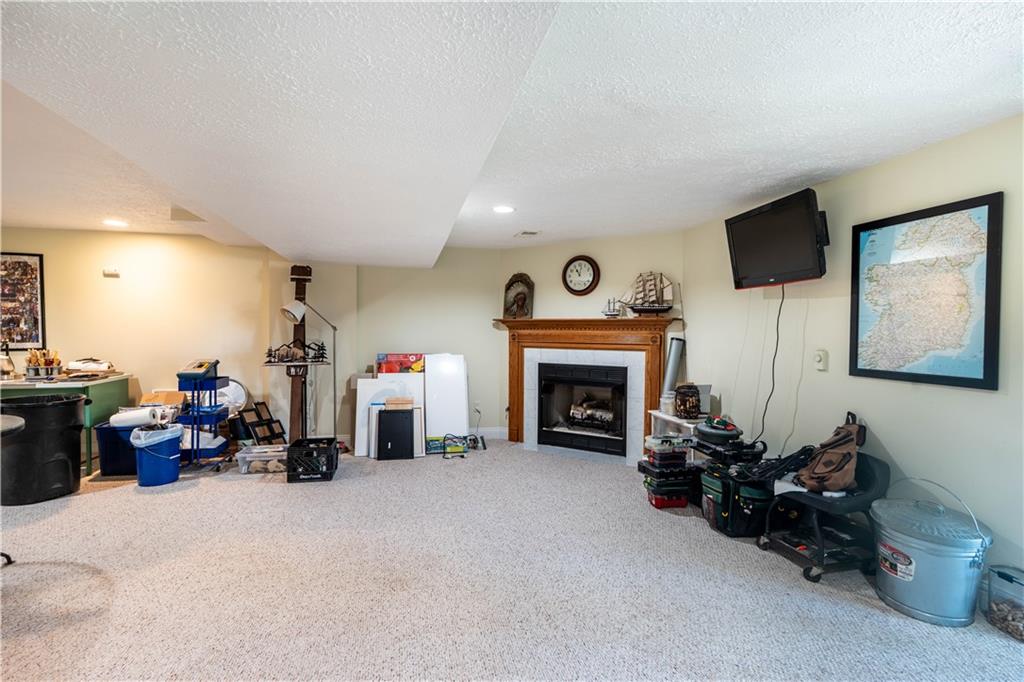 228 Country View Drive Lower Burrell, PA 15068 - Photo 29 of 49 a living room with furniture and a fireplace