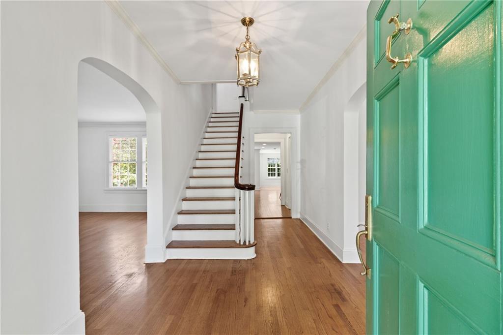 1277 Oakdale Road Northeast Atlanta, GA 30307 - Photo 1 of 1 a view of entryway with wooden floor and stairs
