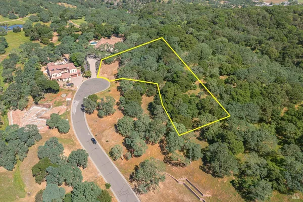 a aerial view of a house with a yard