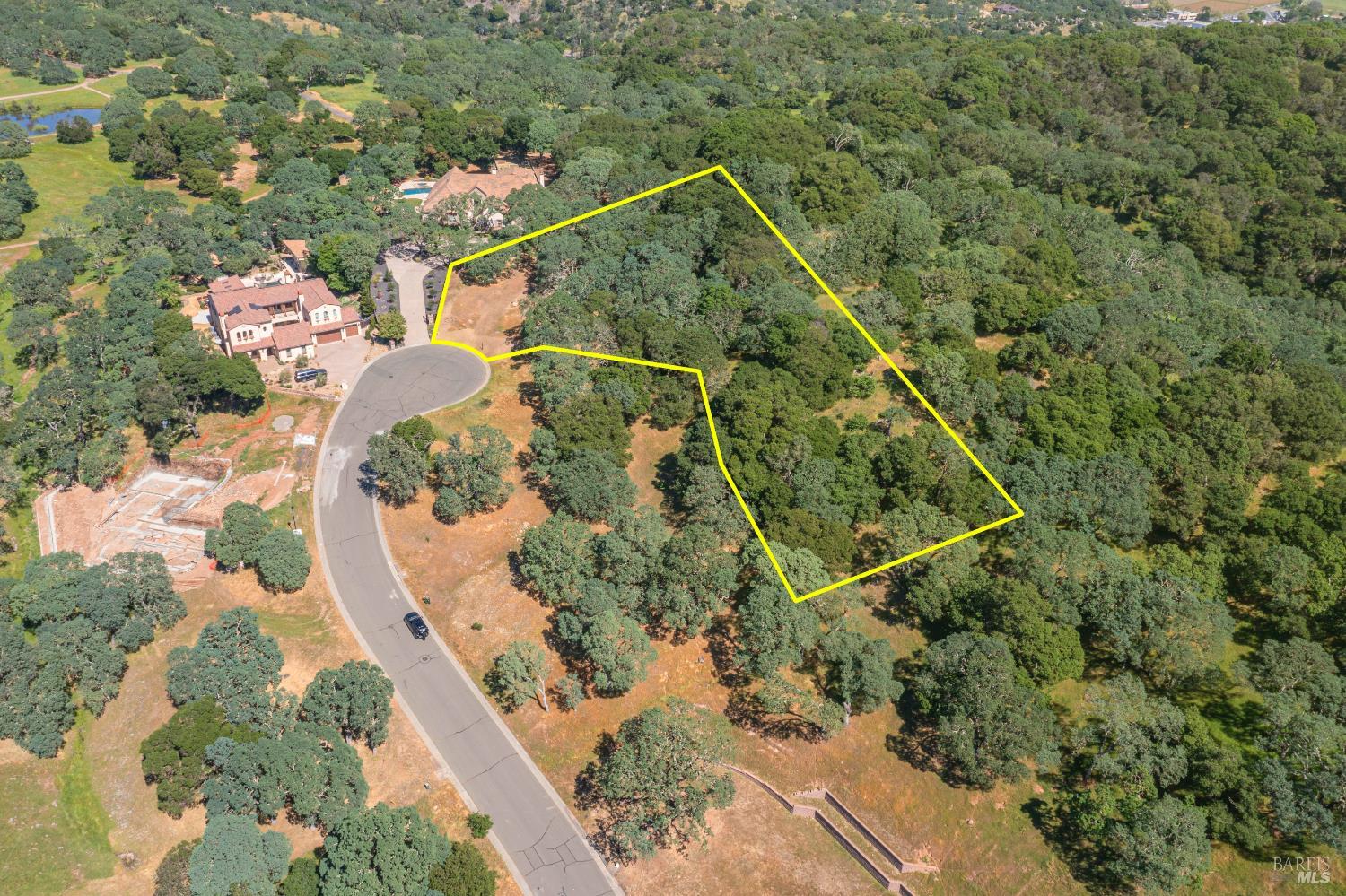 a aerial view of a house with a yard