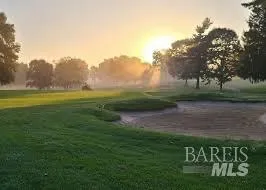 a view of a golf course with a garden