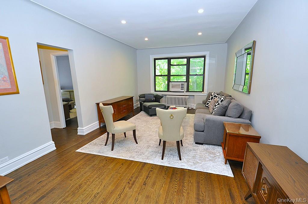 143 Garth Road, Unit 4P Scarsdale, NY 10583 - Photo 1 of 44 Bright and Sunny living room overlooks Garth Woods and has recessed lighting and hardwood floors.