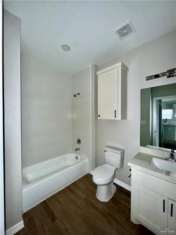 720 Ragland Road, Unit 6 Mission, TX 78572 - Photo 6 of 7 a bathroom with a bathtub shower sink mirror and toilet