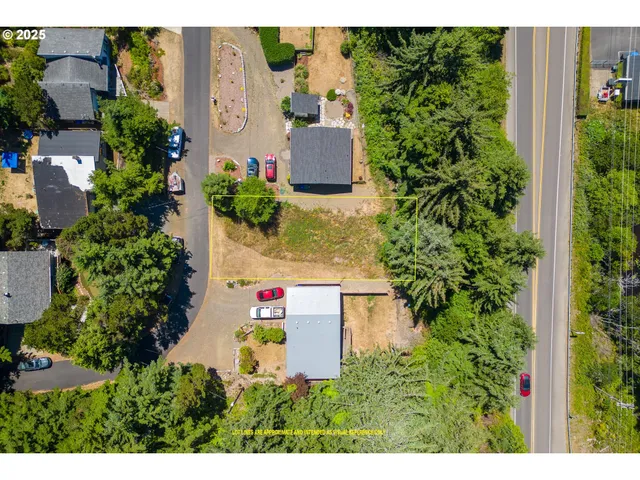 an aerial view of a house with a garden