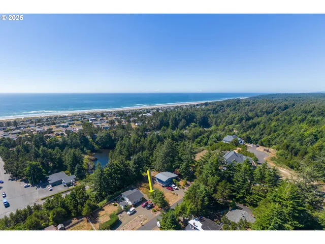 an aerial view of residential house and outdoor space