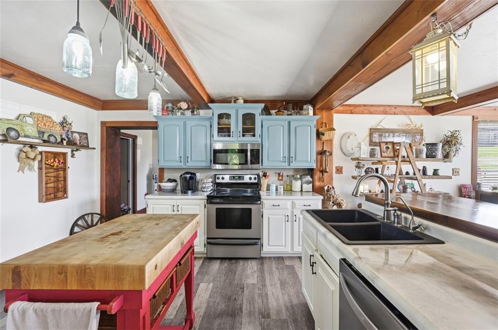 2976 Henderson Road Washington, PA 15301 - Photo 12 of 50 a kitchen with stainless steel appliances granite countertop a sink a stove and a refrigerator