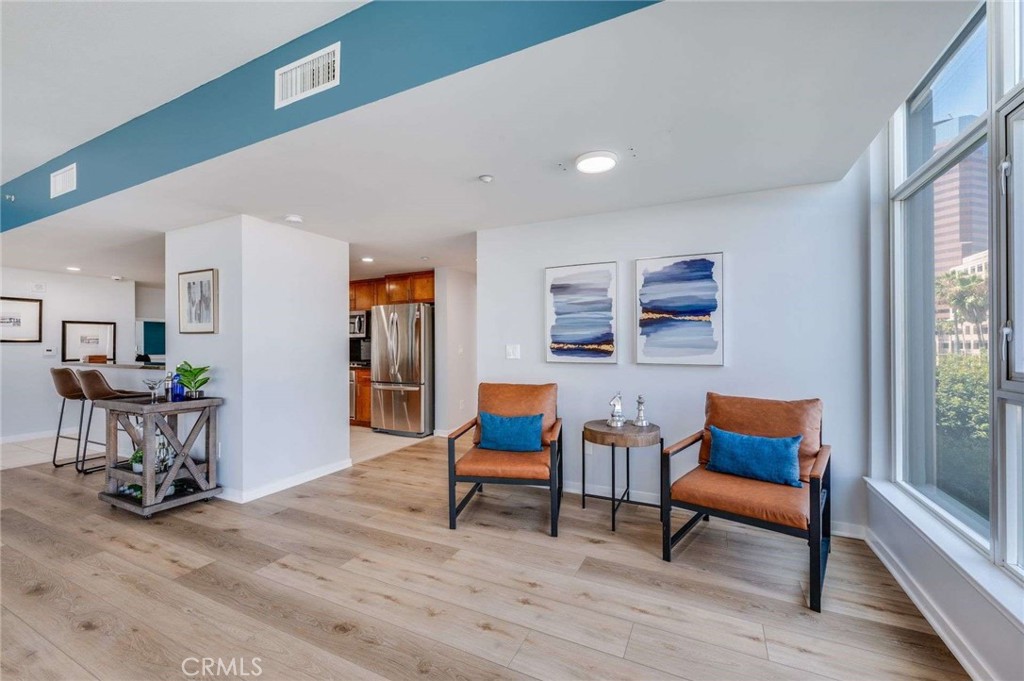 400 West Ocean Boulevard, Unit 206 Long Beach, CA 90802 - Photo 14 of 48 a living room with furniture and a wooden floor