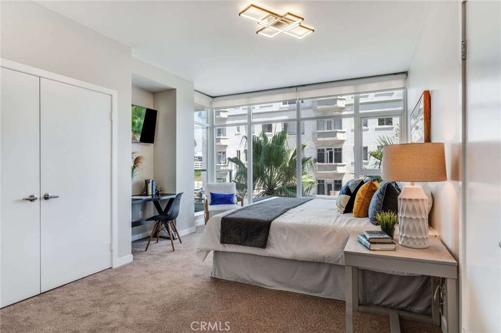 400 West Ocean Boulevard, Unit 206 Long Beach, CA 90802 - Photo 17 of 48 a bedroom with furniture and a window