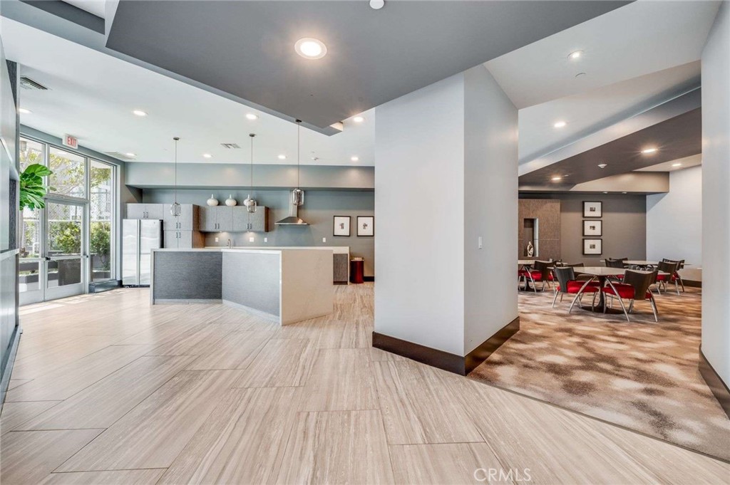 400 West Ocean Boulevard, Unit 206 Long Beach, CA 90802 - Photo 31 of 48 a living room with stainless steel appliances furniture refrigerator and a kitchen view