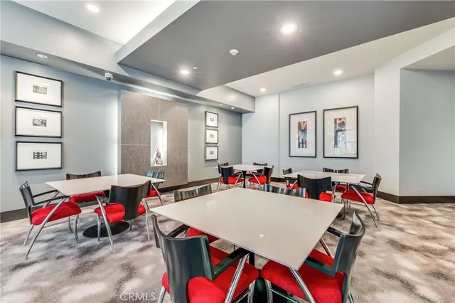 a living room with dining room and furniture