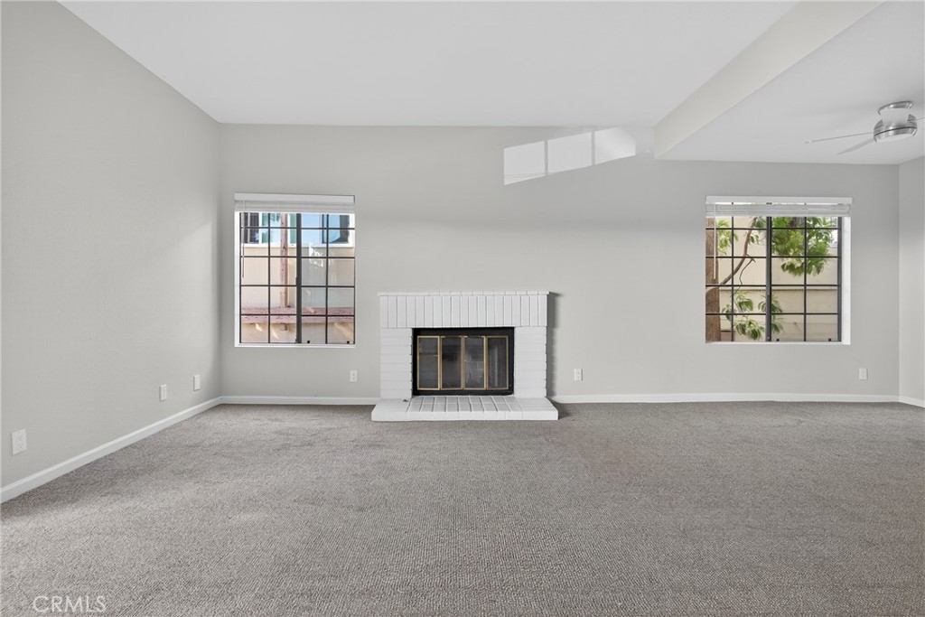 2720 Gramercy Avenue, Unit 5 Torrance, CA 90501 - Photo 13 of 35 an empty room with windows and fireplace