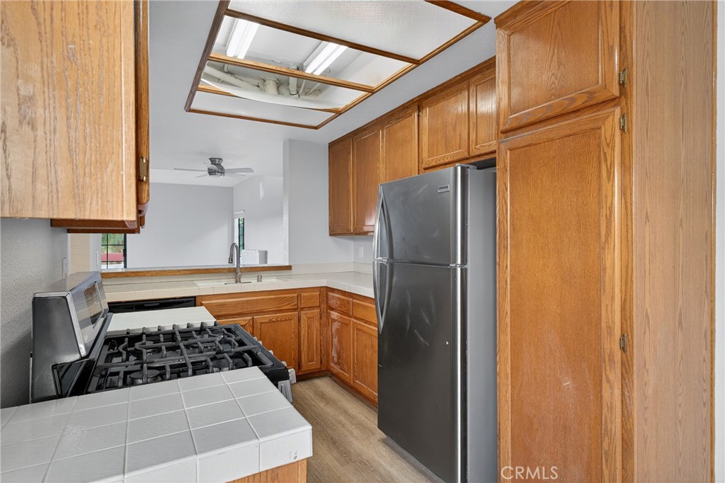 2720 Gramercy Avenue, Unit 5 Torrance, CA 90501 - Photo 20 of 35 a kitchen with stainless steel appliances granite countertop a refrigerator and a stove