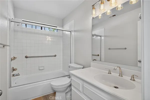 a bathroom with a shower and toilet