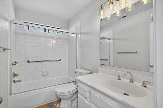 a bathroom with a shower and toilet