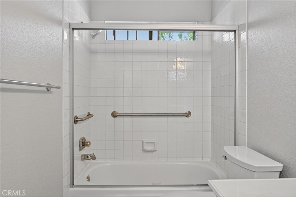 2720 Gramercy Avenue, Unit 5 Torrance, CA 90501 - Photo 32 of 35 a bathroom with a shower and toilet