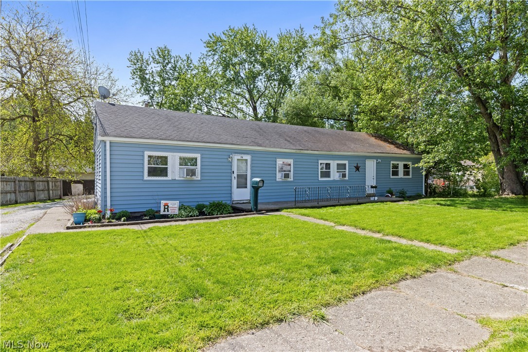 68-70 East Sunset Drive Rittman, OH 44270 - Photo 3 of 49 Single-story structure featuring light blue vinyl siding and a dark shingle roof